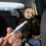 Visual Representation for a man smoking a car in a presence of a child | Credits: Getty Images