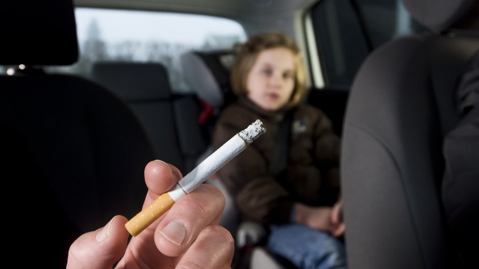 Visual Representation for a man smoking a car in a presence of a child | Credits: Getty Images